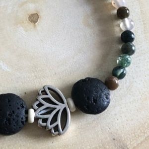 Lotus charm, lava and jasper bead bracelet